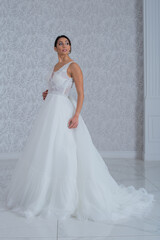 Fototapeta premium Girl with wedding dress posing for photo shoot