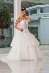 Girl with wedding dress posing for photo shoot