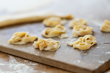 Fototapeta na wymiar Fresh homemade pasta on board