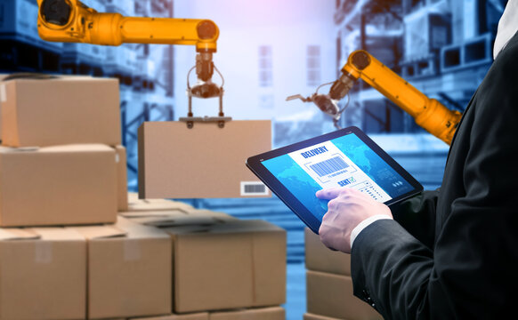 Smart robot arm systems for innovative warehouse and factory digital technology . Automation manufacturing robot controlled by industry engineering using IOT software connected to internet network .