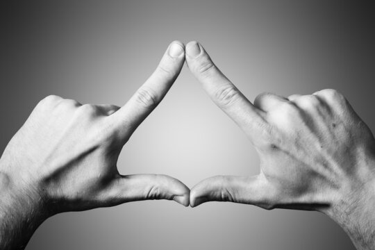 Triangle Shape Made With Fingers. Two Hands Connected Together Background. Illuminati Triangle. Fingers Sign Isolated On White.