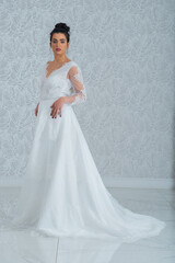 Fototapeta premium Girl with wedding dress posing for photo shoot