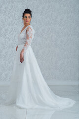 Fototapeta premium Girl with wedding dress posing for photo shoot