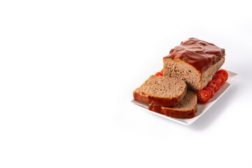 Traditional American meatloaf with ketchup isolated on white background.