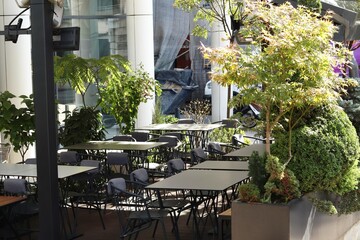 Empty tables of a street cafe 