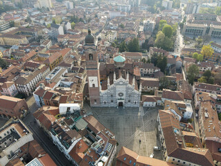 Fototapeta premium Aerial view of facade of the ancient Duomo in Monza (Monza Cathedral). Drone photography of the main square with church in Monza in north Italy, Brianza, Lombardia, near Milan.