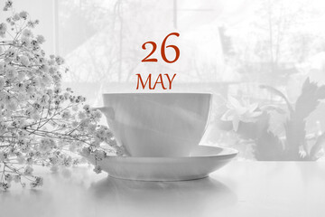 calendar date on light background with porcelain white tea pair and white gypsophila with copy...