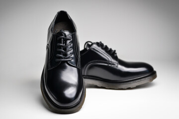 Black leather male shoes, white background. Classic male black leather shoes. 