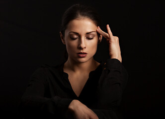 Business strong thinking woman find the answer in clever mind with closed eyes with fingers near...