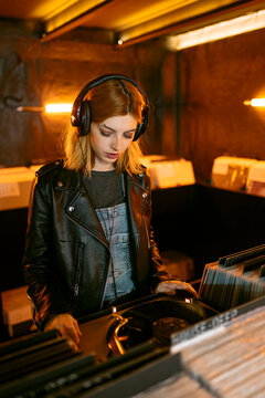 Woman playing record player
