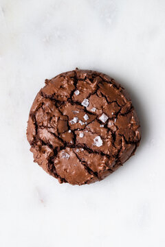 Delicious brownie cookie on table