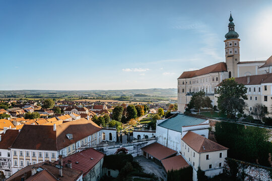 View of Mikulov with beautiful Baroque castle on the rock on sunny day,south Moravia,Czech Republic.Dominant of town skyline.Czech Chateau in Palava wine region.Picturesque town among vineyards.