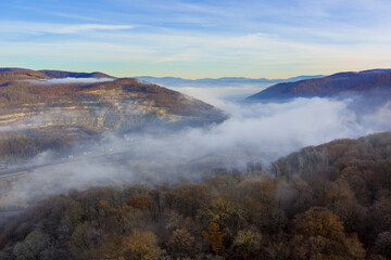 Mountain peaks in morning fog over mountains