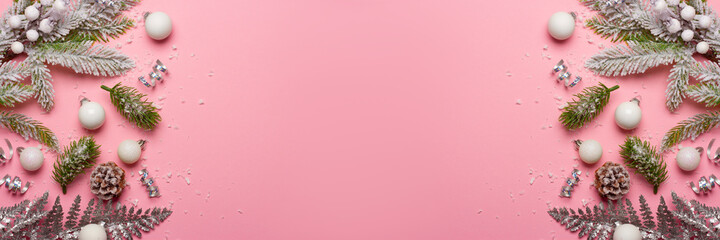 Christmas composition with decorations and ornametns on pink background with empty space