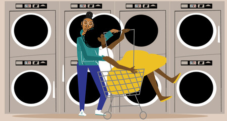 Lesbian woman pushing partner in laundry cart 