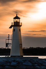 A close up view of the lighthouse in Sandspit marina,  Patchogue, New York, in the evening  during...