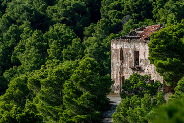 An old abandoned building in ruins on the Island of Gorgona, Livorno, Italy