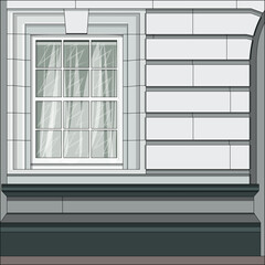 The facade of the building with a window in the classicism style.