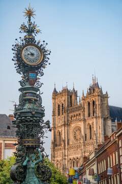 Amiens, France/07,26,2018: 
View of the Dewailly clock in Amiens with the Cathedral in the background