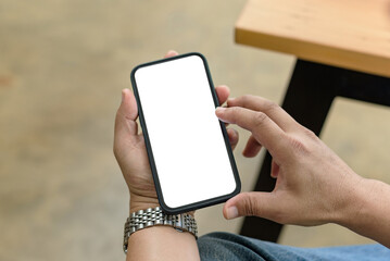 Close up. Man hands holding smartphone blank white screen for text message or information.