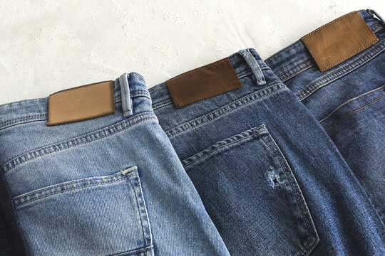 Heap of blue jeans in studio