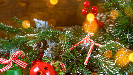 Christmas lollipops canes on brown wooden background with copy space