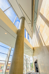 Obraz premium Window and blue sky. Abstract fragment of the architecture of modern lobby, hallway of the luxury hotel, shopping mall, business center in Vancouver, Canada. Interior design.