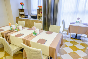 Interior of a hotel restaurant, breakfast room.
