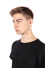 Fototapeta premium Portrait of a teenager, boy in puberty isolated on a white background