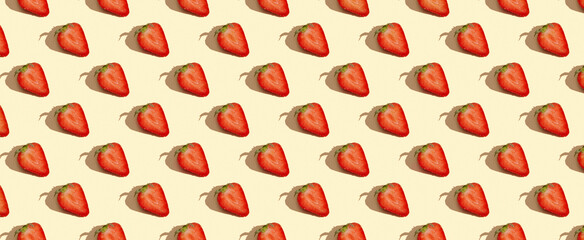 Pattern of strawberries on yellow pastel background