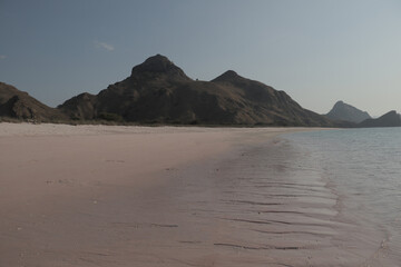 Calm beach with pink sand at Long Pink Beach, Labuan Bajo