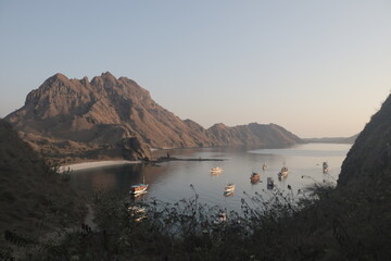 Serene view of the Padar island with many ships at anchor