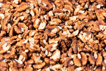 Pieces of peeled walnuts forming a solid background texture.