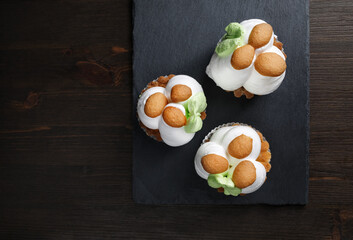 Three delicious sweet pastries on stone board. Flat lay.