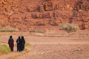 Saudi women roaming in al ula next to dadan tombs