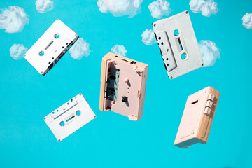 Fototapeta premium Cassettes fall from the sky. Minimal retro aesthetic concept.