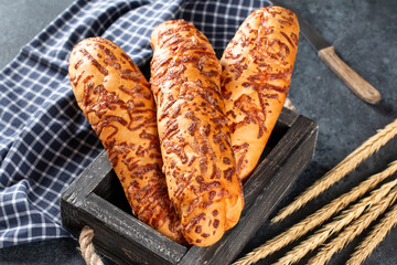 Cheese bread. Homemade Cheesy Breadsticks on a dark background