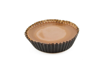 Chocolate dessert in short cupcake paper package isolated on white background