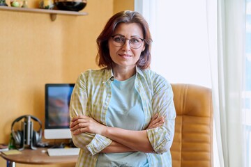 Portrait of a successful mature business woman at home office