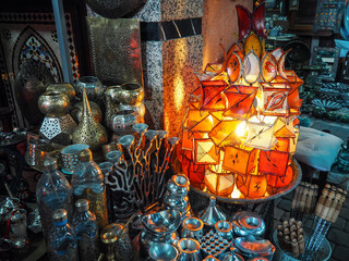 Naklejka premium Oriental candle lamps on display at souk - traditional street market in Morocco, closeup detail