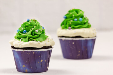 Christmas cupcakes on a white background. Selective focus, place for text.