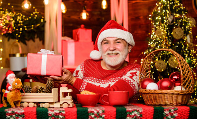 Fototapeta na wymiar bearded man eat cookies. winter holiday mood. santa have dinner. for santa. christmas composition. ready for new year party. xmas party celebration. grandpa drink milk