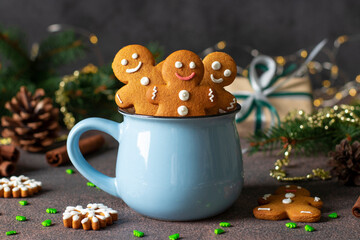 Homemade gingerbread cookies in the form of fabulous gingerbread men and christmas trees in blue...