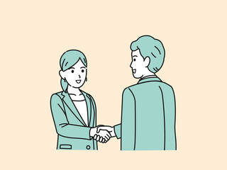 握手をする　スーツ姿の男女　会社員　仕事　挨拶　取引　合意　依頼　ビジネス