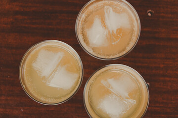 iced drinks shots in a wooden table