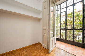 Vintage wrought iron gazebo in living room with plaster shelves and parquet floors