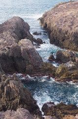 Waves, rocks, and whirlpools at the cliffs