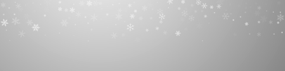 Sparse snowfall Christmas background. Subtle flyin
