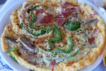 Greek pizza at beautiful island Santorini in Greece.