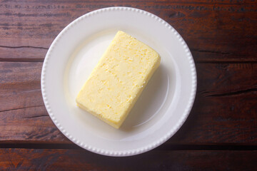 fresh organic farm yellow butter made with cow's milk on rustic wooden table